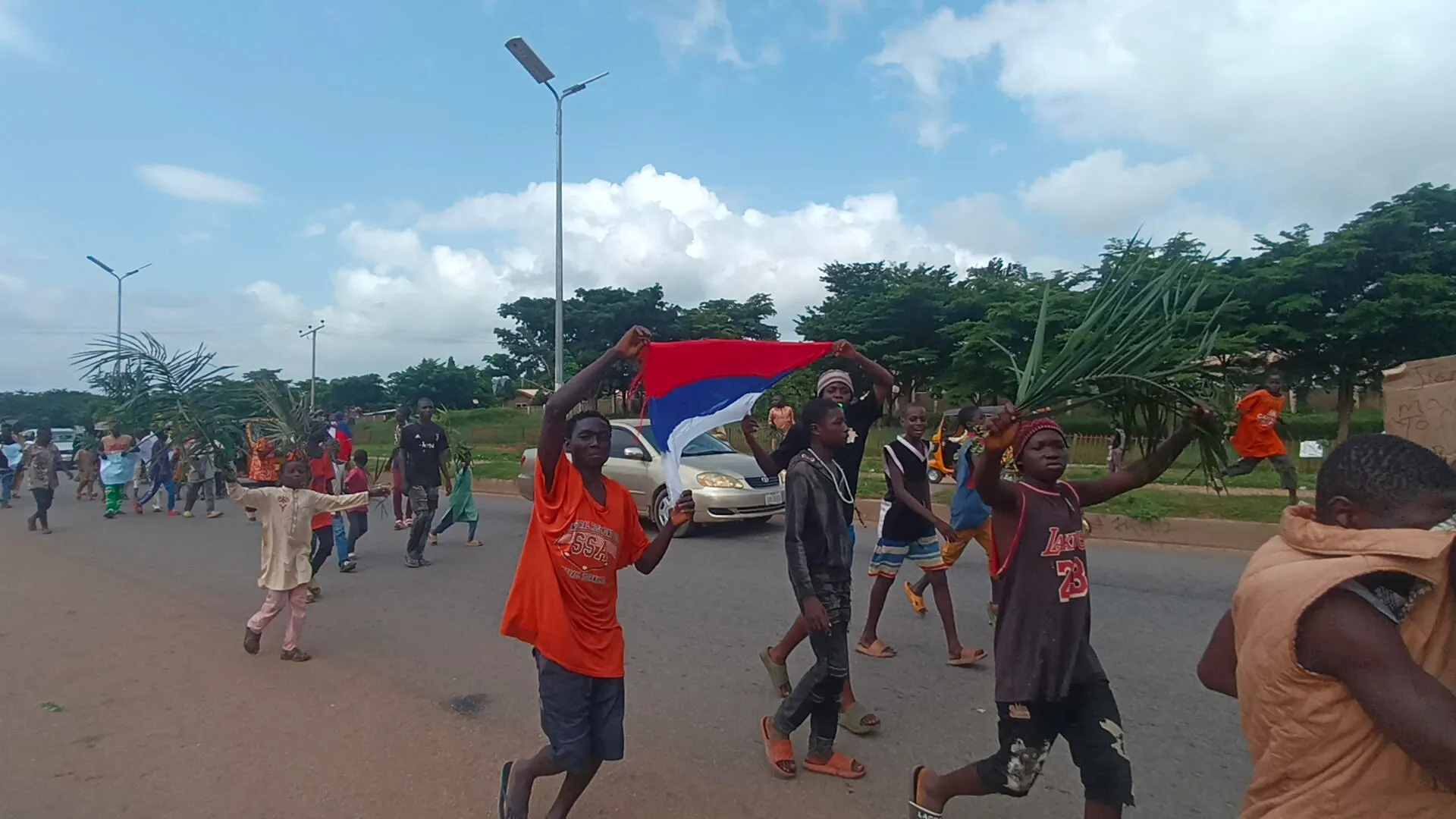 Protesters flout FG’s order, wave Russian flag in Abuja (photos)